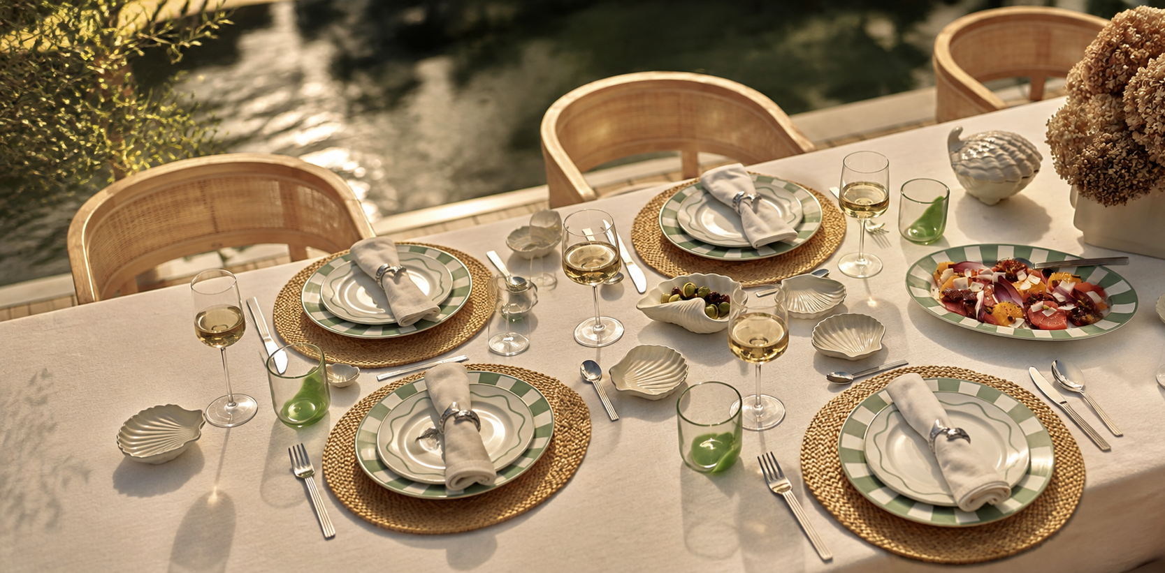 Elegant outdoor table setting with dinnerware and glassware